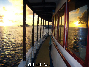 Sunset Reflections on Maldivian Liveaboard by Keith Savill 